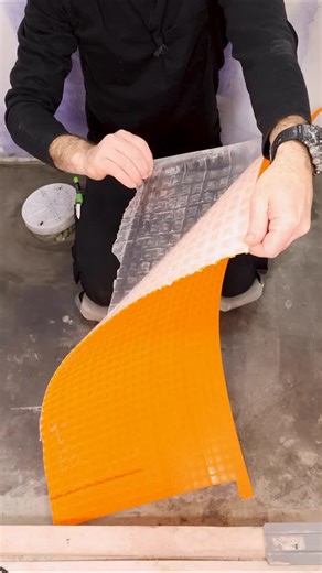 Home Repair Tutor on Instagram: "I’m installing Schluter DITRA Peel and Stick over concrete. Using PRIMER-PS can enhance the bond. I like this option because it’s easy and fast to install. I use a float to activate the pressure-sensitive adhesive. Then I can immediately set tile over it. Many thanks to Schluter for sponsoring this tutorial #schlutersystems #tilefloor #homerenovation #sponsored"