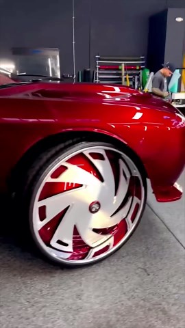 Candy red Hellcat Redeye Challenger on 34” DUB floaters
