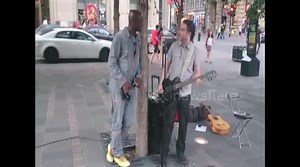 Watch the incredible moment British singer Seal joins Montreal busker for impromptu duet of 'Stand by Me'