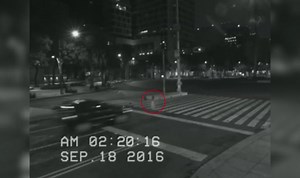 Spooky moment car drives through the body of a ghost