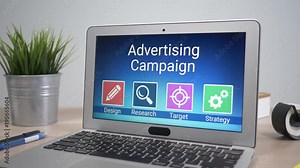 Advertising strategies showing on a laptop computer screen sitting on a desk. Camera is slowly turning around the computer.