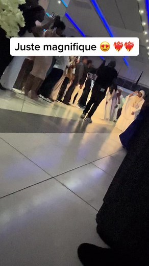 Celebratory Wedding Dance in Elegant Indoor Setting