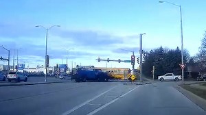 Frantic moment as service truck crashes into school bus full of children