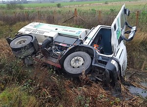 VIDEO: Driver rescued from ditch after roadsweeper crash