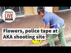 FROM THE SCENE: Flowers laid at AKA's shooting site as father and friends speak with police