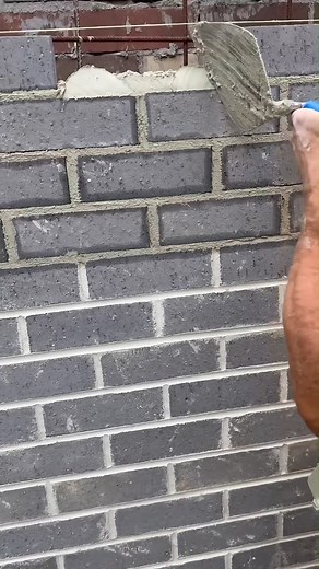 Buttering in the closure brick – basically when you apply mortar to the ends of the brick before sliding it into place to make sure that joint is fully sealed and bonded. | Civil Engineering USA