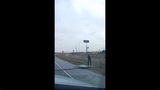 State Trooper Drags Fallen Sign From Roadway