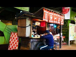 An old-fashioned hand-pulled ramen stall standing quietly under the overpass Japanese ramen stall