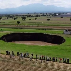 190K views · 257 reactions | A giant sinkhole measuring 70 meters in diameter has appeared in southeastern Mexico where it's threatening to swallow a nearby house. The crater, which appeared Saturday in Santa Maria Zacatepec, began at five meters in diameter and has quickly grown in size. | cheddar news | Facebook