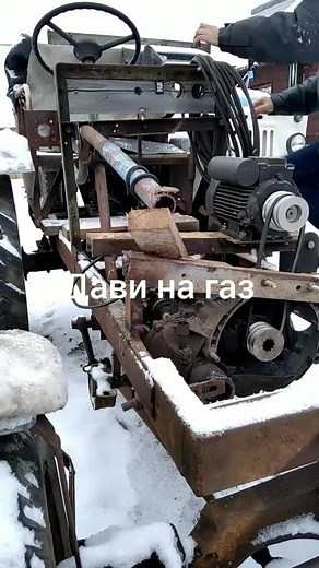 Close-Up of a Rusty Old Tractor in Snowy Landscape