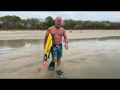How to correctly put your swimfins on, and how to enter and exit the surf with swimfins on.