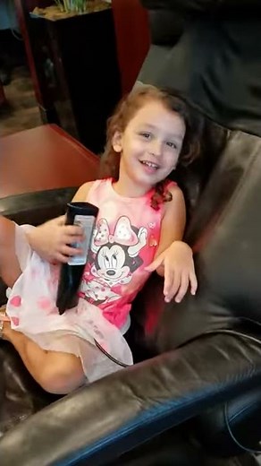 Toddler on a massage chair the first time