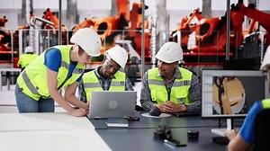 clip-3514572013-engineer-using-computer-electric-car-assembly-factory