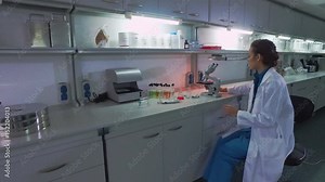Woman scientist work laboratory microscope at chemical lab. Female scientist preparing laboratory research. Scientist at laboratory workspace. Steady shot of lab worker ready for chemical experiment