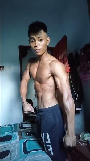 ripped Indonesian flexing for body contest
