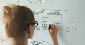 clip-1052305042-web-development---ui-ux-designer-working