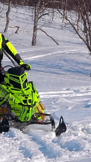 Exciting Snowmobile Wheelie Tricks in Snowy Landscape