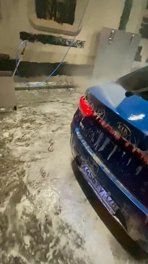Blue Kia Sedan Car Wash Experience