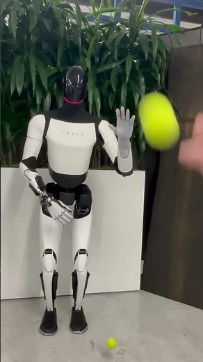 Tesla Optimus robot catching a ball