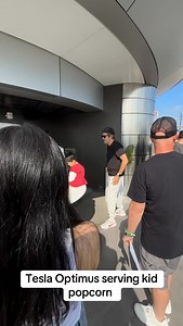 Tesla Optimus serving kid popcorn at the Tesla Diner #fyp #viral #tesla #optimus #tesladiner | Tesla Owners of Silicon Valley