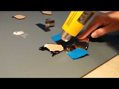 Remove adhesive (black mastic) from back of mirror