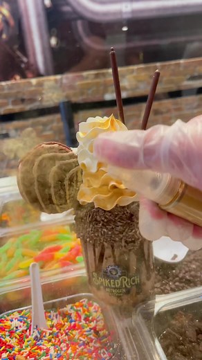 💰Pot of Gold milkshake magic! 🍫🌈 Creamy chocolate shake, gooey fudge brownies, luscious chocolate sauce, chewy fudge cookie, topped with whip and edible glitter for extra fun! Served in a cool souvenir jar. 😍🥤 #MilkshakeMania #ChocoDelights #ShakeSensation #SweetTreatTime #BrownieBliss #ChocoHeaven #CookieCrave #WhipCreamDreams #EdibleGlitterParty #ShakeMagic #ChocolateCharm #DessertGoals #YummyInMyTummy #TastyTreasures #FlavorExplosion #SipHooray #SatisfyYourCraving #TreatYourselfWell #Sug