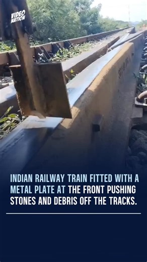 VIDEO NATION on Instagram: "Indian Railways has introduced a new safety mechanism designed to improve track protection and passenger security. A specialized metal plate is being attached to the front of trains to help clear stones and small obstacles from the tracks before the locomotive passes over them. The device is intended to reduce the risk of incidents caused by debris placed on railway lines, a concern that has occasionally disrupted services. Videos of the mechanism in action have circu