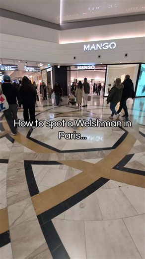 How to Spot a Welshman in Paris 🇫🇷🏴 | Only One Wearing Shorts 😂 Walking through the huge shopping centre near Disneyland Paris and there’s a simple way to spot the Welshman in the crowd… Everyone else is wrapped up for the weather — and there I am walking around in shorts like it’s a mild summer day. If you’re from Wales or the UK, you’ll know the rule: it’s never actually cold enough for trousers. Anyone else abroad who still dresses like they’re back home? 😅 #WelshAbroad #DisneylandParis 