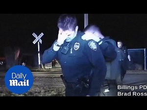 Cop breaks down in tears after shooting armed robbery suspect - Daily Mail