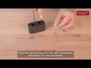 Place your hearing aids in the Desktop Charger