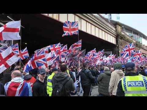Britain First clash with left wing extremist in Manchester.