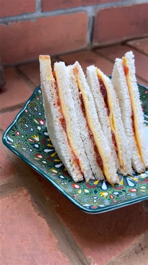 Smita Deo on Instagram: "Jam & Cheese Sandwiches or Pink Shampoo Sandwiches? (VOTE) ______ Recipe Take 4 slices of bread - Smother 2 slices with butter - Smother the other 2 slices with jam - Place cheese slices in between - Make the sandwich, trim the crust, and serve Crisp, creamy, sweet, and salty — the perfect treat for kids (and adults who love a little nostalgia). _______ [ Jam and Cheese Sandwich, Strawberry Jam Sandwich Recipe, Easy Kids Sandwich, Childhood Favourite Sandwich, Sweet and 