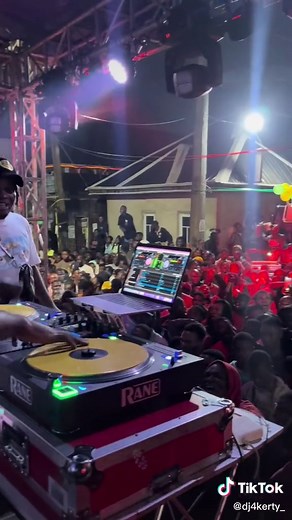 Lively Nightclub Scene with DJ Performance