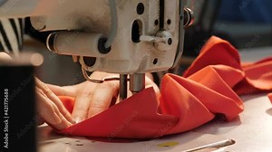 Clothes Making. Female hands working on Tailoring. Fabric factory. Industrial Textile Sewing machine.