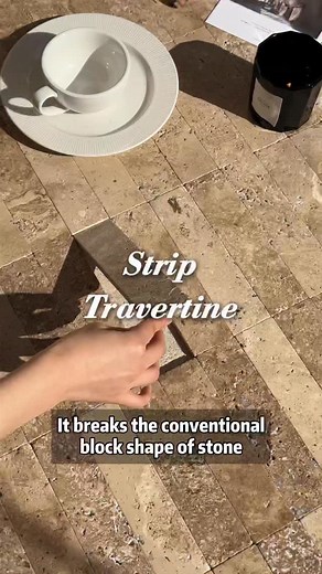 Regular stone is too cold, and cement self-leveling is dull, but this strip travertine is a game-changer. It breaks the conventional block shape of stone; its long, thin strips add a sense of extension, with natural hole texture and a raw, natural roughness. #design #designer #material #floortile #stone #stonetile #naturalstone #hoteldesign #interiordesign | CU design collection