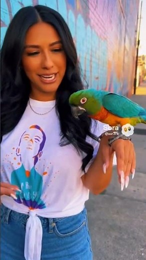 woman rapping with parrot