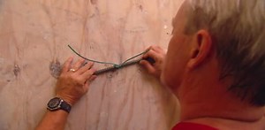 Installing a Temporary Plywood Door Without Fasteners - Today's Homeowner