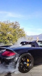 Tim Schrick takes a black Porsche Carrera GT through the breathtaking Alpine mountain roads. Captured in 2009, this drive highlights the Carrera GT’s raw V10 power and timeless design, set against a backdrop of stunning scenery. A true piece of automotive history. Via @motorvision.tv | Motorchive