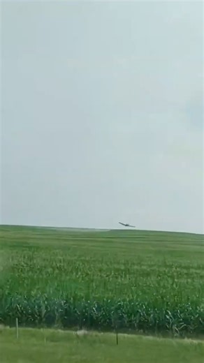 Low flying crop duster spraying