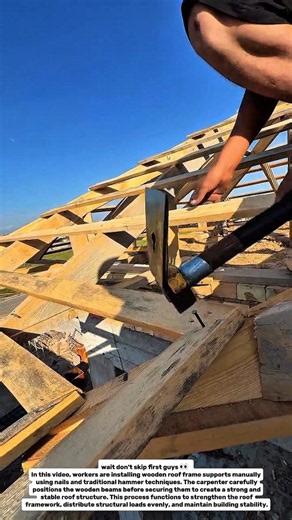 Manual Roof Frame Installation Using Traditional Hammer Technique.