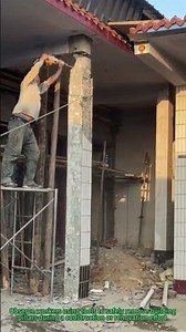 Column Demolition: Workers Dismantle Building Pillars in Construction Project