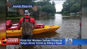 PIZZA HUT HELPS HARVEY VICTIMS: Pizza Hut delivers pizzas to Hurricane Harvey victims in one Texas neighborhood by kayak. DETAILS: http://cbsloc.al/2wLwfLQ | CBS Philadelphia