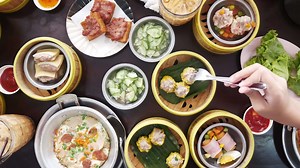 Download top down view to table full with streamers with dumpling dimsum for morning breakfast chinese meal for free