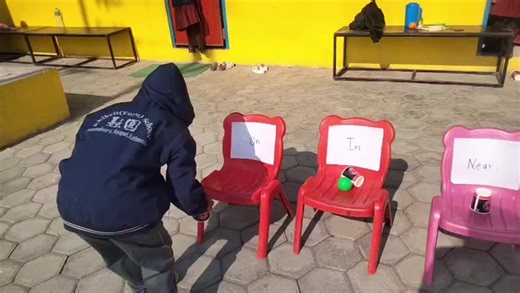 Learning through practical play—understanding in, on, under, behind, in front of, and between.