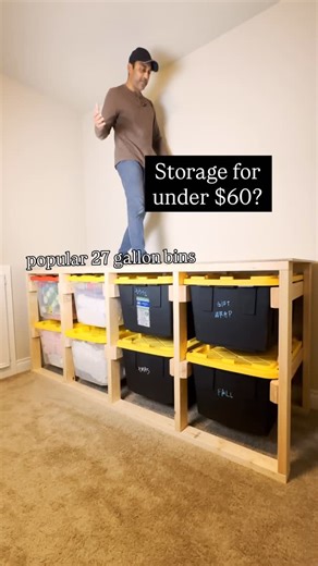 Sanju Patel | DIY from a Dad on Instagram: "One of my most useful projects! Earlier this year, I swapped flimsy plastic shelves for a solid 27-gallon bin organizer built from 2x4s. If you’ve got an empty wall, you’ve got some storage potential. I used fifteen 2x4s and just three cuts: 30½” rails, 30” legs, and simple cross bracing. I beveled the rails, sanded everything smooth, then assembled the legs with a 1” gap between rails, locking it all together with 2½” screws. I set the bin height at 1