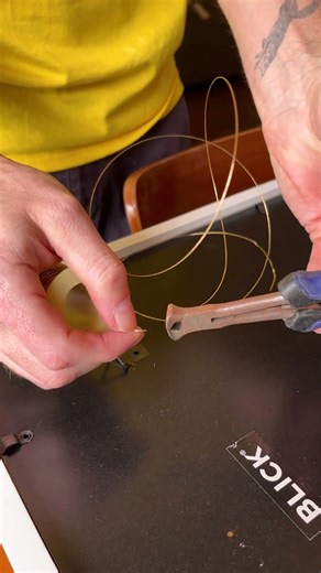 Attach wire to picture frame hooks to easily hag artwork! #homedecor #gallerywall #hometips #artwork