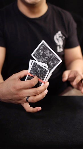 Learn how to fling a card right out of the deck! Using the Dark Knight playing cards by @theory11 #magic #magictrick #magictricks #magictricksvideos #cardtrick #cardtricks #tutorial #learn #rubberband #impress #batman | CardMechanic
