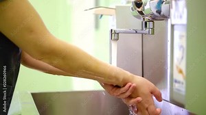medical worker is washing hands before operating in a room, sterilized and cleaning