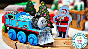 Just in time for Christmas, Liam is building a huge Santa's Workshop wooden railway track with our Thomas and Friends pieces! We just watched The Polar Express last night, so he also tells a quick story with our toy trains! All Engines Go! | Kids Toys Play
