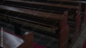Wooden benches in the church. A place for novices of the Catholic religion. Willingness to organize, prayers. Dark room.